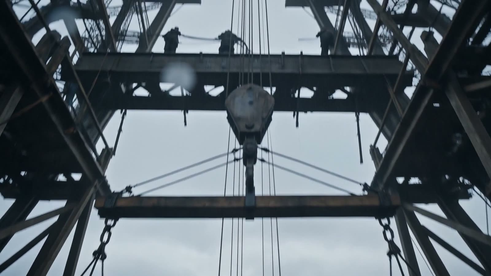Looking up beneath the first platform at the lifting tackle and cables